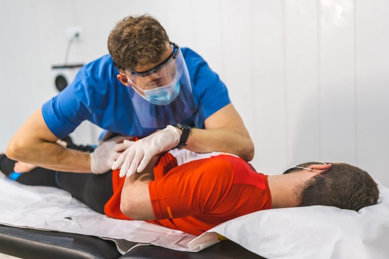 a-physiotherapist-with-mask-and-screen-resting-the-2022-02-16-01-54-54-utc-min